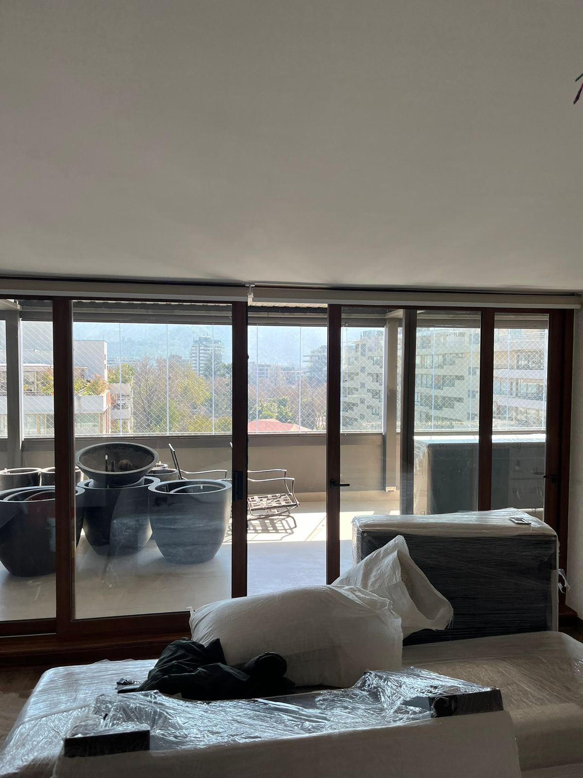 Sistema de ventanas PVC folio nogal en penthouse